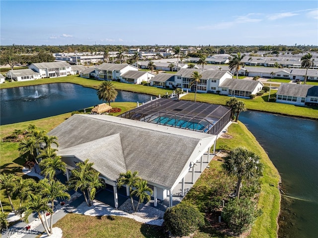 aerial view with a residential view and a water view