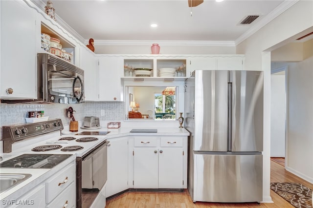 1515 Myerlee Country Club Blvd Unit 6, Fort Myers, FL 33919 - kitchen featuring crown molding, open shelves, visible vents, freestanding refrigerator, and white electric range