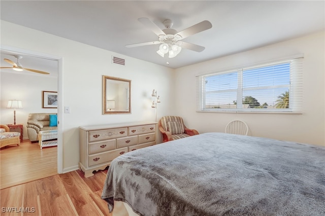1515 Myerlee Country Club Blvd Unit 6, Fort Myers, FL 33919 - bedroom with baseboards, ceiling fan, visible vents, and light wood-type flooring