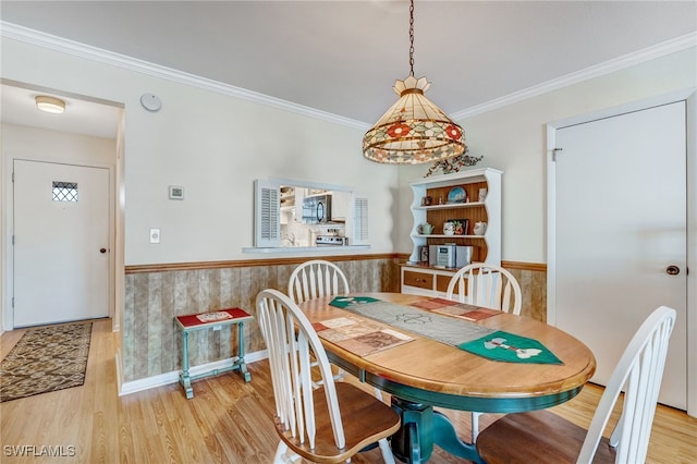1515 Myerlee Country Club Blvd Unit 6, Fort Myers, FL 33919 - dining space with light wood-type flooring, crown molding, and wainscoting