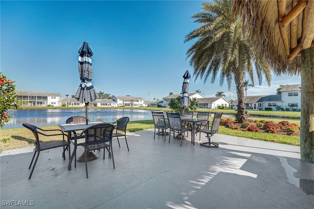 1515 Myerlee Country Club Blvd Unit 6, Fort Myers, FL 33919 - view of patio / terrace with a residential view, outdoor dining area, and a water view