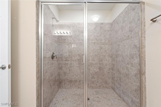 bathroom with a shower stall