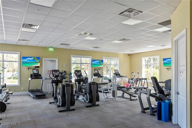 exercise room featuring carpet floors and visible vents