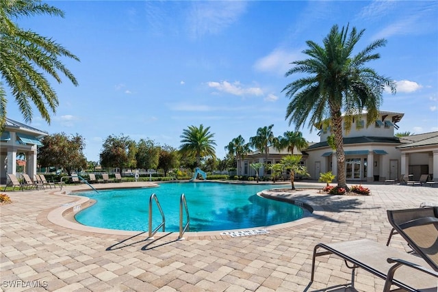 pool with a patio area