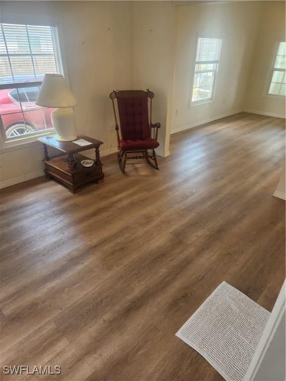 sitting room with wood finished floors and baseboards