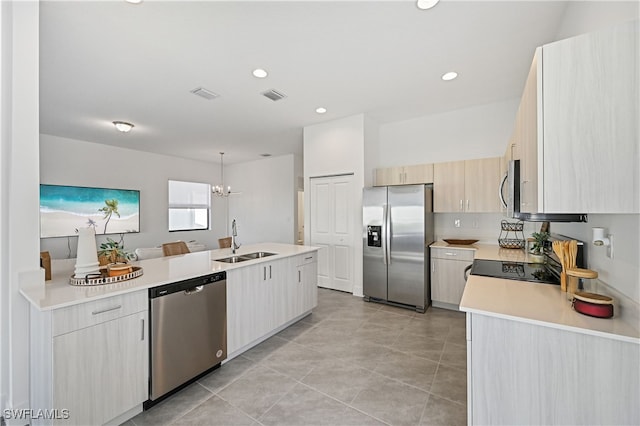 kitchen with visible vents, a sink, recessed lighting, appliances with stainless steel finishes, and light countertops