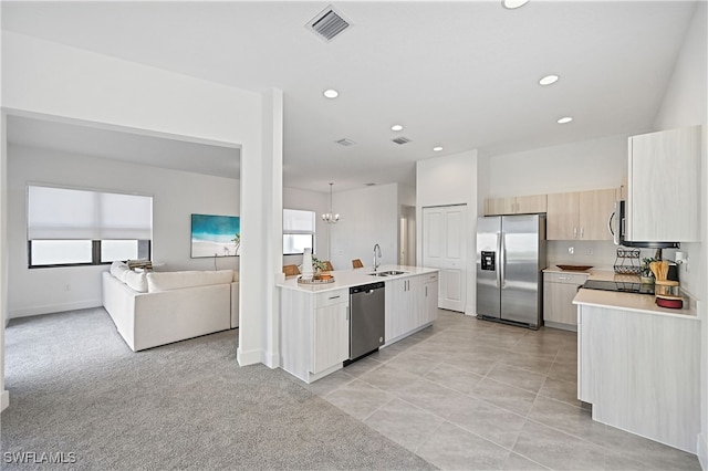 kitchen featuring visible vents, light countertops, recessed lighting, stainless steel appliances, and a sink