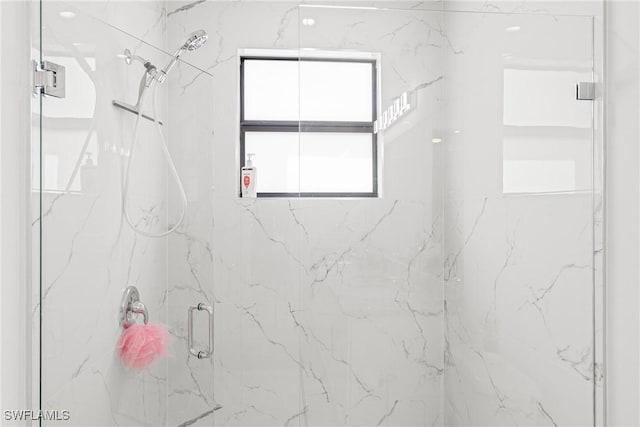 full bathroom with a marble finish shower