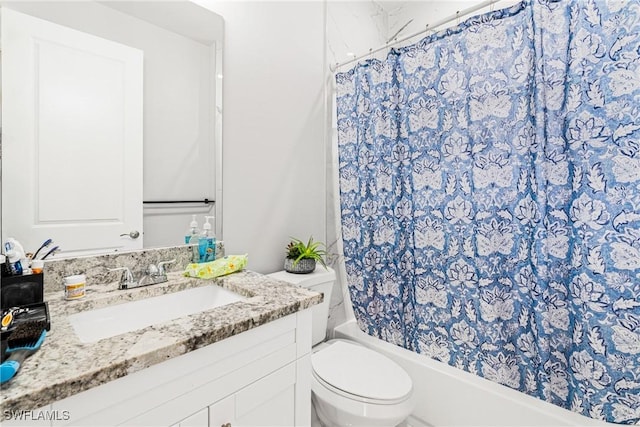 full bathroom with toilet, shower / bath combo with shower curtain, and vanity