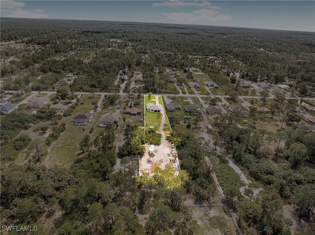 bird's eye view featuring a wooded view