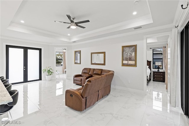 living area featuring marble finish floor, french doors, a raised ceiling, visible vents, and baseboards