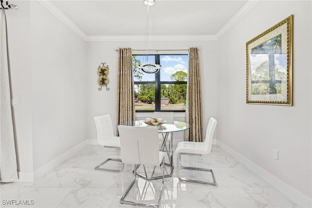 dining room with a chandelier, marble finish floor, ornamental molding, and baseboards