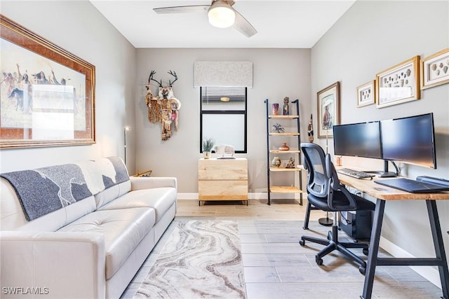 home office with baseboards, a ceiling fan, and wood finished floors