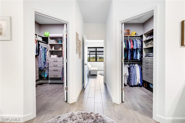 walk in closet featuring light wood-type flooring