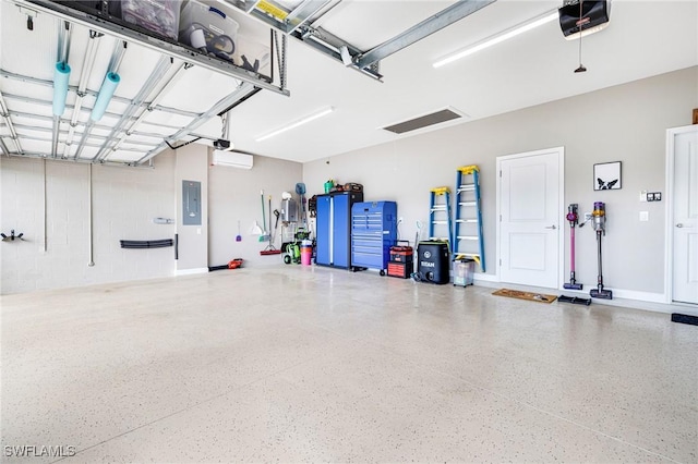 garage featuring electric panel and a garage door opener