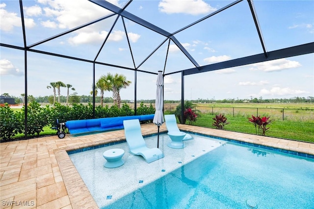 pool with a patio area and glass enclosure