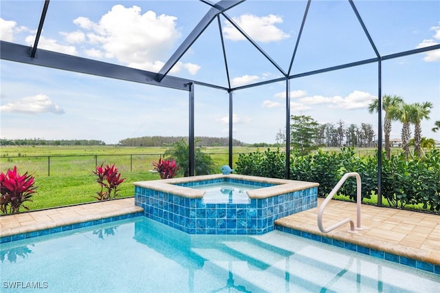 view of pool featuring a patio, fence, an in ground hot tub, a lanai, and a rural view