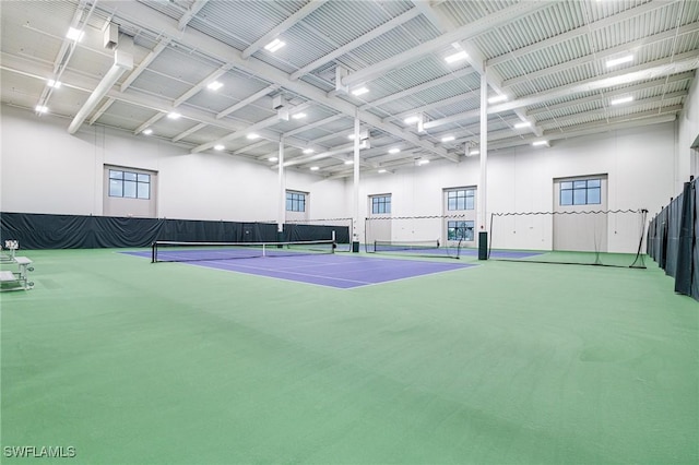 view of tennis court with fence