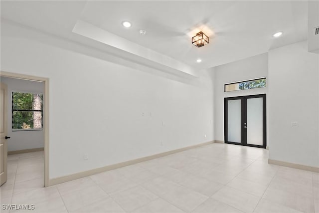 spare room featuring visible vents, recessed lighting, french doors, and baseboards