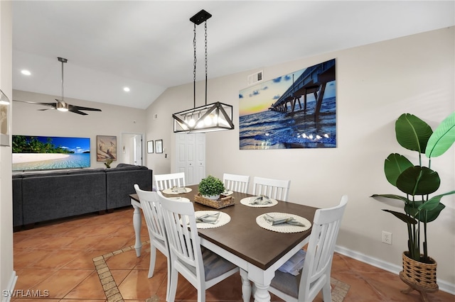 dining room featuring light tile patterned floors, visible vents, vaulted ceiling, and a ceiling fan