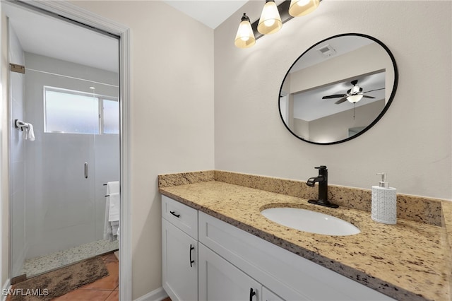 bathroom with tile patterned flooring, visible vents, a shower stall, and vanity