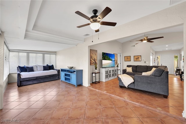 living area featuring lofted ceiling, visible vents, ceiling fan, and light tile patterned floors