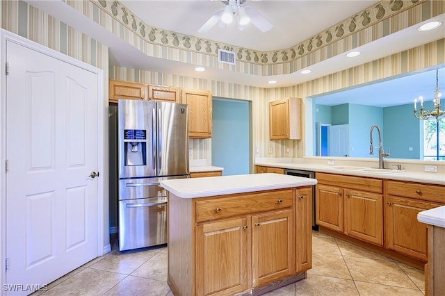 kitchen with stainless steel fridge with ice dispenser, a sink, wallpapered walls, a kitchen island, and light tile patterned flooring