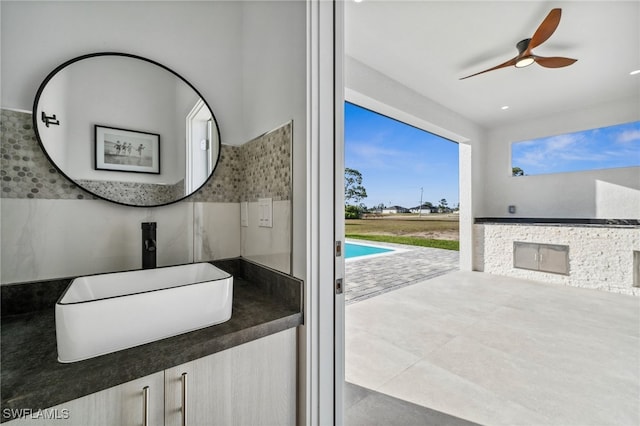 bathroom featuring a sink and ceiling fan