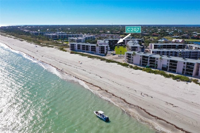 aerial view with a beach view and a water view