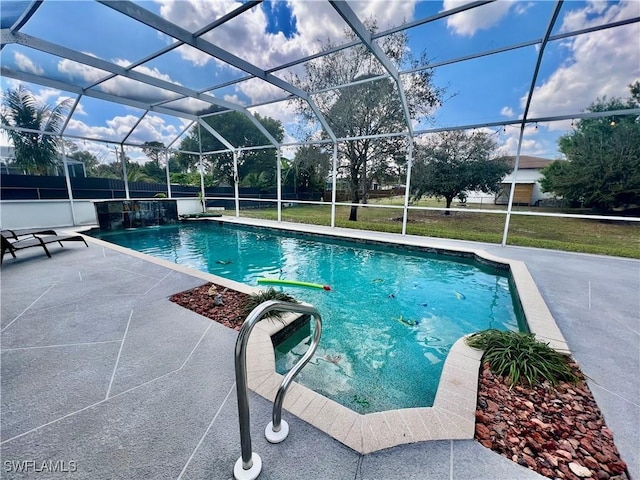 pool with a patio area and a lanai