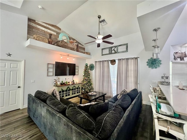 living room with visible vents, a ceiling fan, wood finished floors, high vaulted ceiling, and baseboards