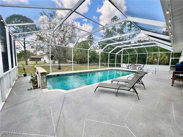 outdoor pool featuring a patio and a lanai