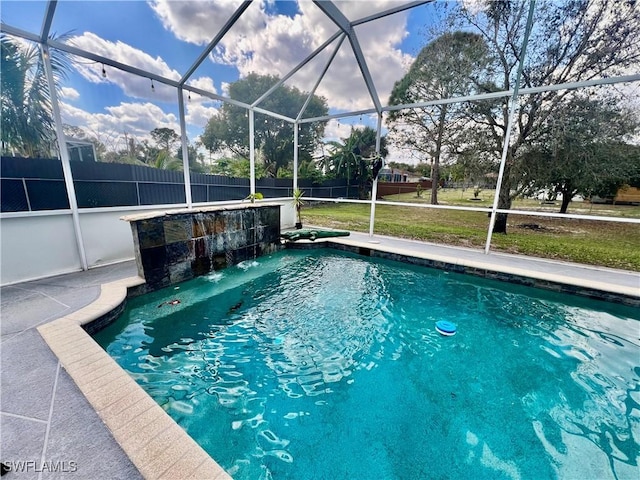 outdoor pool featuring a patio, a lanai, and fence