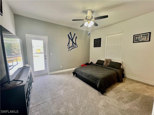 bedroom with access to exterior, carpet, and baseboards