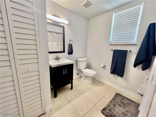 full bathroom with visible vents, toilet, vanity, tile patterned flooring, and baseboards