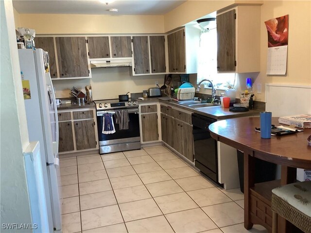 kitchen with under cabinet range hood, electric range, a sink, freestanding refrigerator, and dishwasher