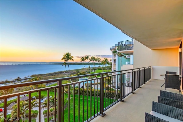 balcony at dusk with a water view