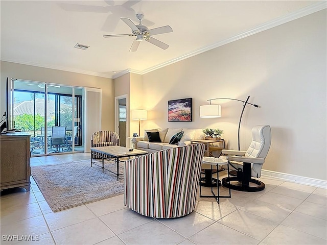 living room featuring baseboards, a ceiling fan, visible vents, and ornamental molding