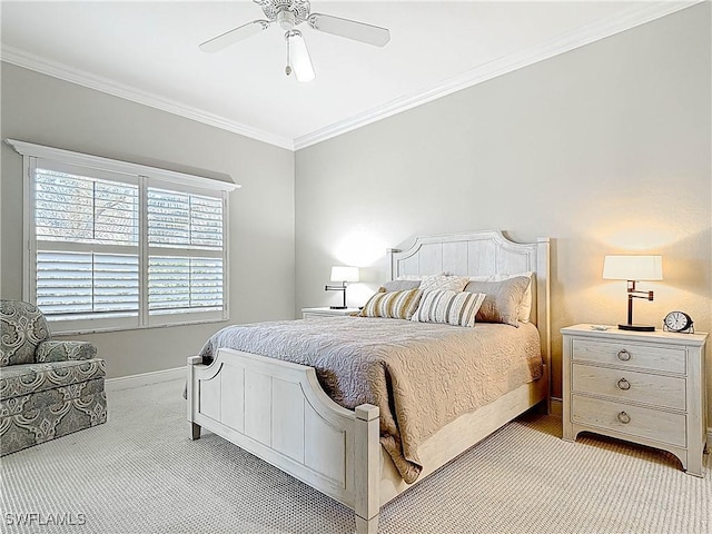 bedroom with crown molding, carpet flooring, baseboards, and ceiling fan