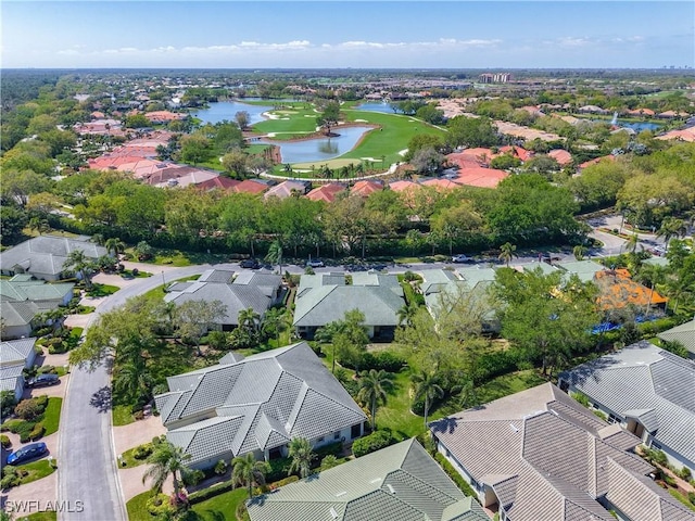 drone / aerial view with a residential view and a water view