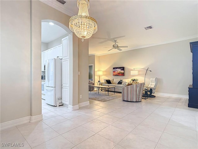 living area with visible vents, baseboards, light tile patterned flooring, crown molding, and ceiling fan with notable chandelier