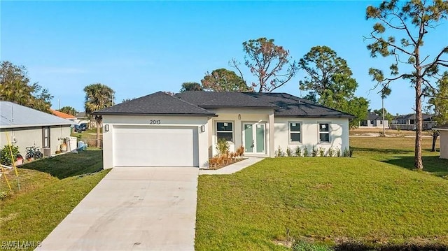 ranch-style house featuring a garage, stucco siding, concrete driveway, and a front yard