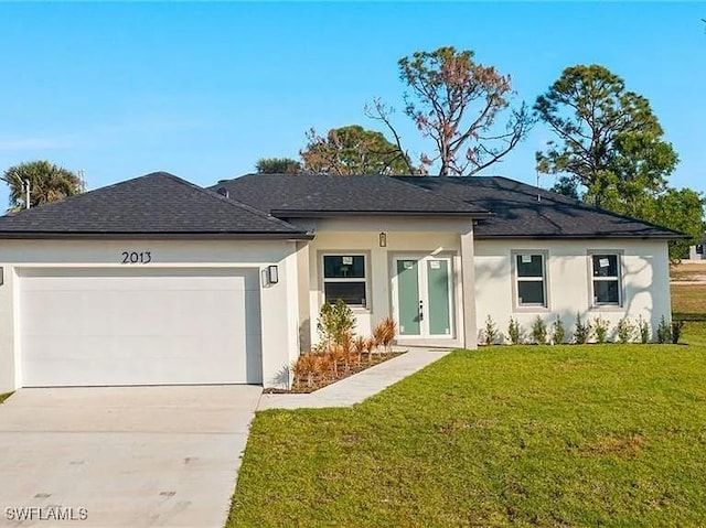 ranch-style home featuring a garage, a front yard, driveway, and stucco siding