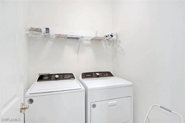 laundry room with laundry area and washer and clothes dryer