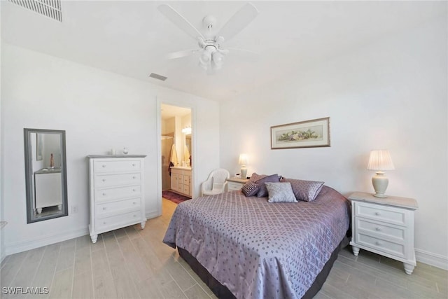 bedroom featuring a ceiling fan, visible vents, light wood-style flooring, and baseboards