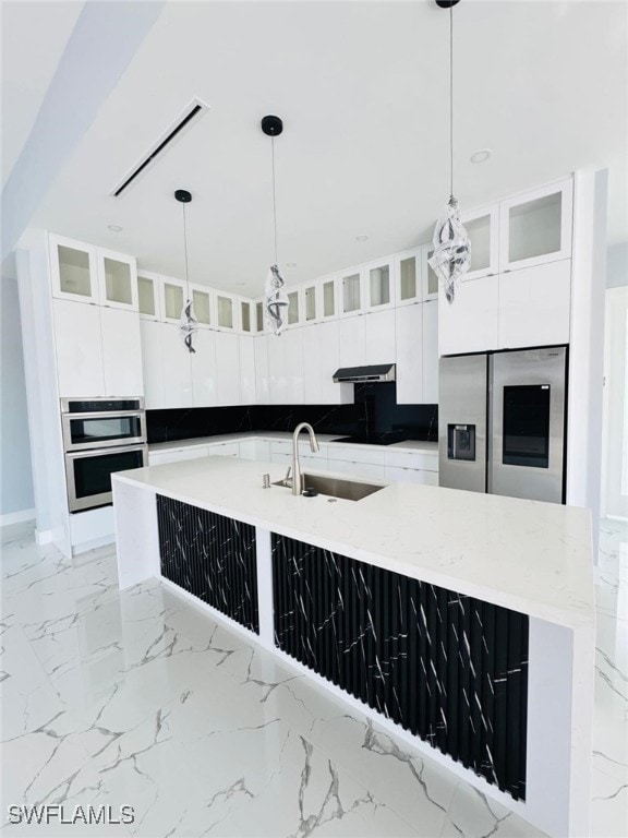 kitchen with marble finish floor, modern cabinets, stainless steel appliances, and a sink