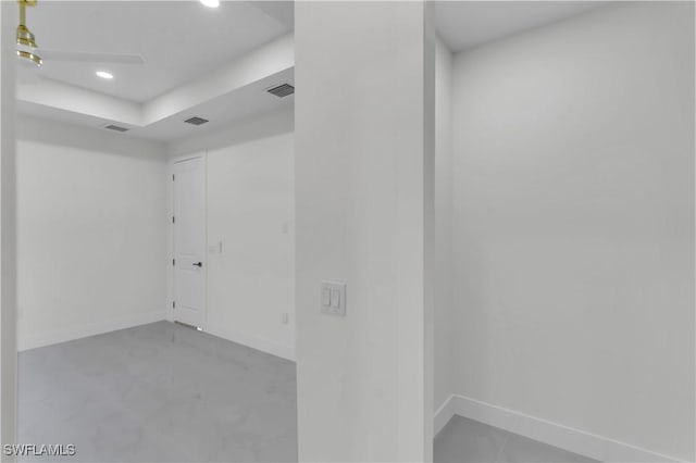 spare room featuring recessed lighting, visible vents, and baseboards