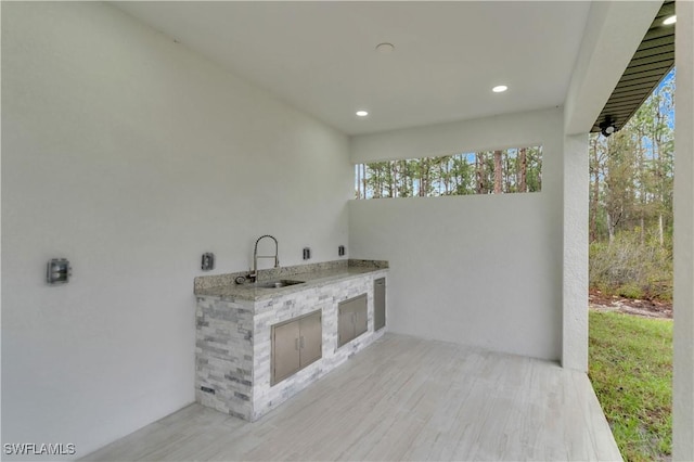 view of patio / terrace featuring a sink and an outdoor kitchen