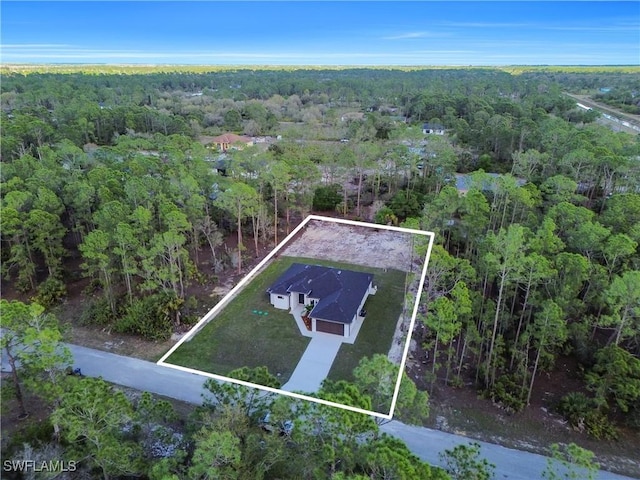 aerial view featuring a view of trees