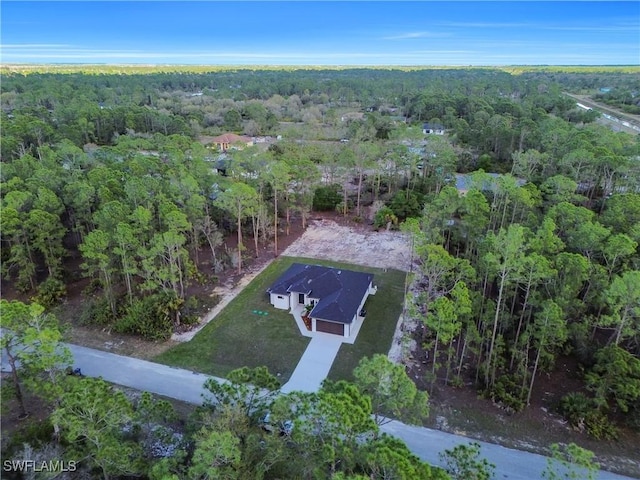 drone / aerial view with a view of trees